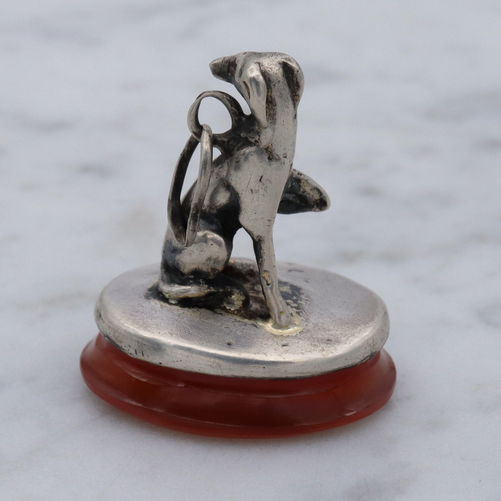 Early Victorian sterling silver greyhound dog on carnelian fob pendant